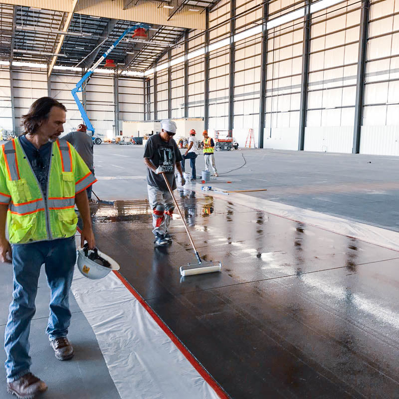Newly placed concrete contains more moisture than seamless flooring products can tolerate. For new industrial construction projects that cannot wait 1-4 months for the concrete to dry, use an ASTM F3010 Moisture Mitigation Primer like ACTECH 2170FC. 
